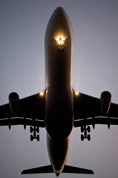 istock Landing airplane, head lights on, low-angle view 485418126
