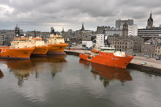 Oil support vessels in dock at Aberdeen in Scotland stock photo