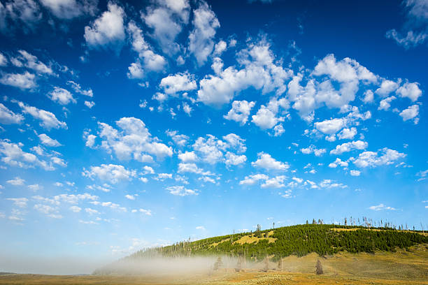Blue sky with clouds and morning mist stock photo