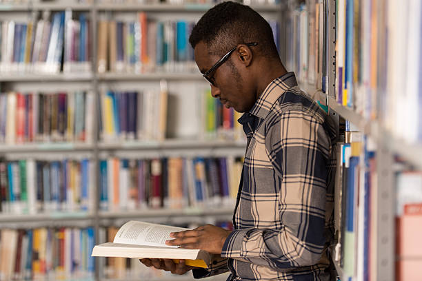 istock Male College Student In A Library 485421644