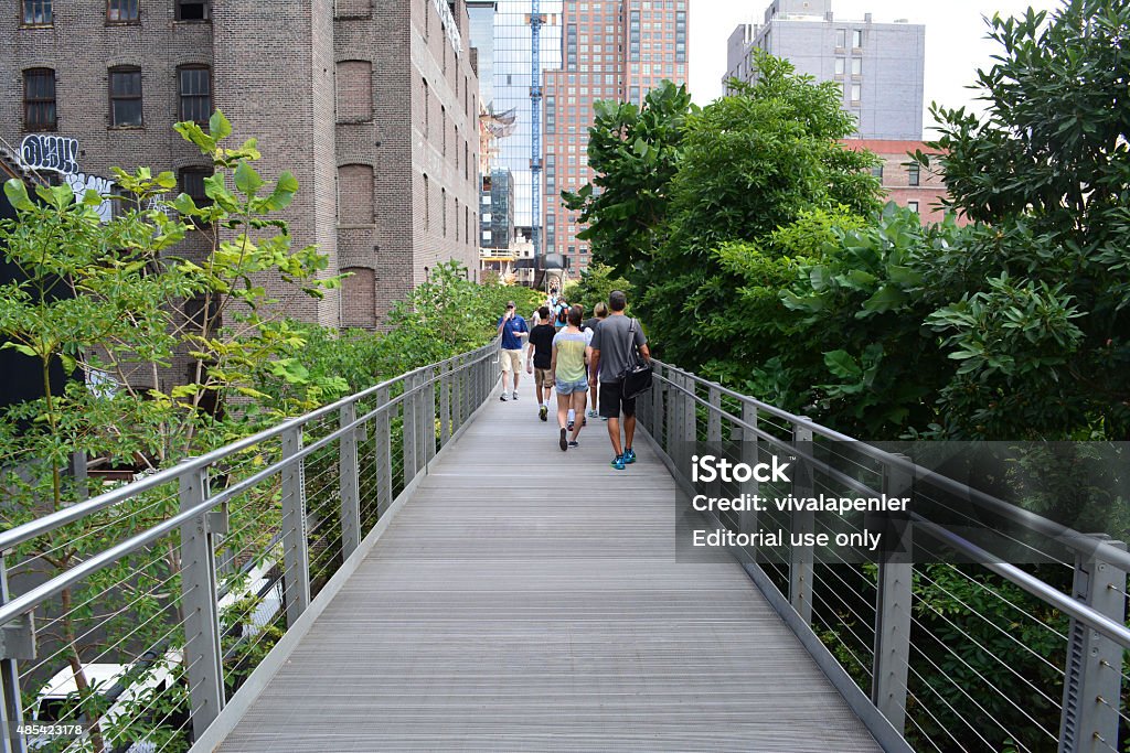 New York City New York City, USA - August 22, 2015: People walking along the path on the High Line in New York City on August 22, 2015. 2015 Stock Photo