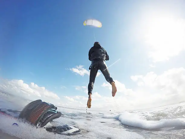 A kitesurfer, jumping into the air in Peter-Ording, Germany. GoPro Hero 4 black edition image.