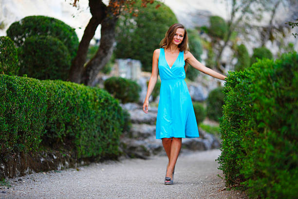 istock woman in green park 485429323