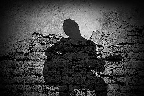 istock Shadow of Guitarist On Grunge Brick Wall 485433890