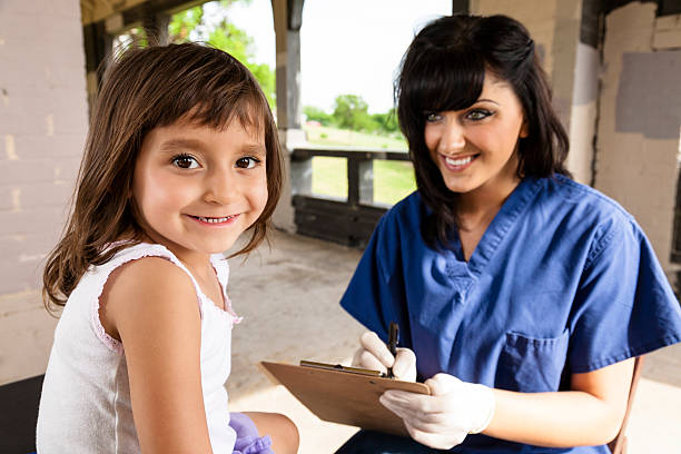 istock Cute little girl looking back during medical exam 485434361