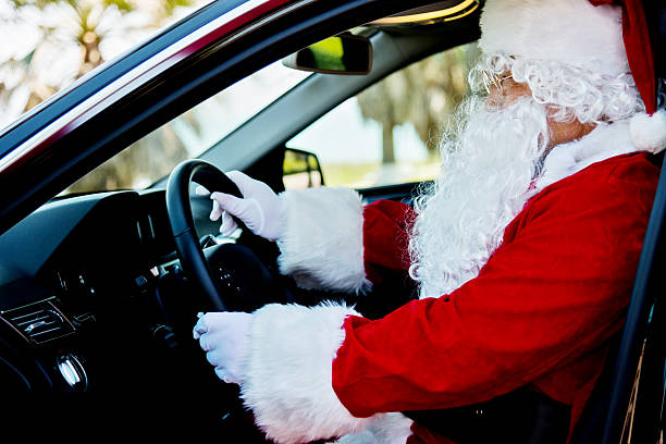 istock Santa claus driving a car 485434834