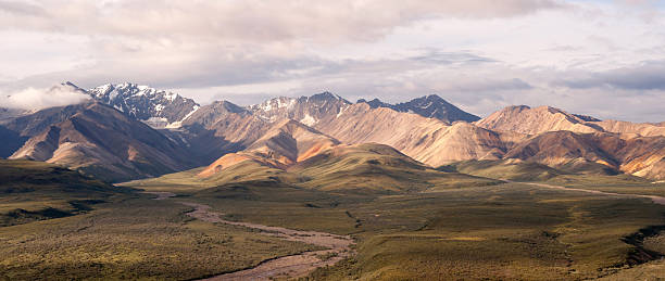 istock Puffy clouds blue sky Alaska Range Denali National Park 485434840