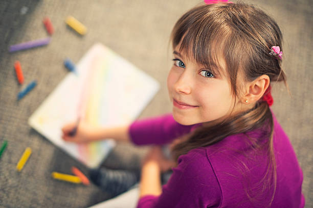 istock Beautiful little girl drawing 485435075