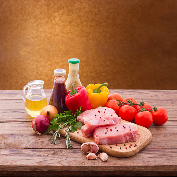 istock Food. Meat barbecue on wooden surface. 485435083