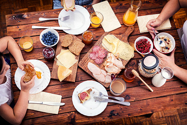 istock Young Happy Family Having Breakfast 485435954