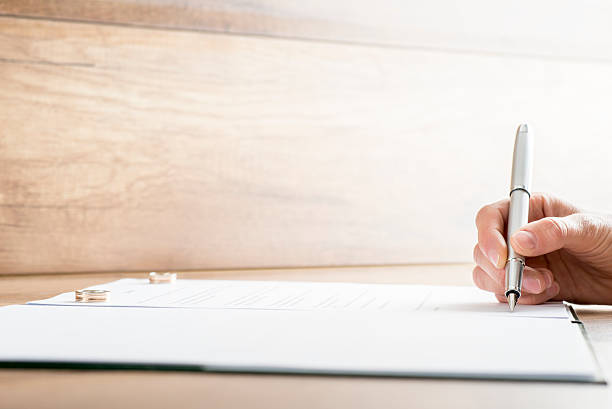 istock Signing marriage contract or divorce papers 485436012