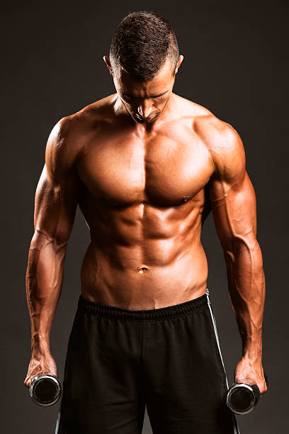 istock Masculine man in holding dumbbell 485439258