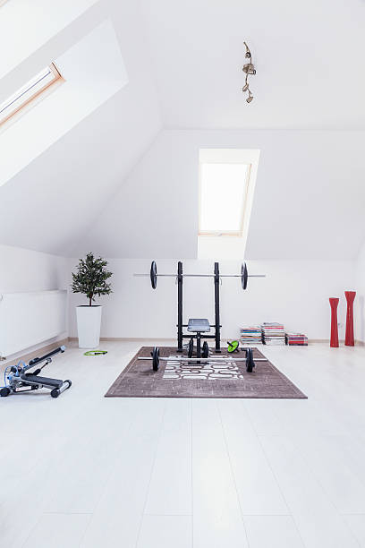 Gym at home Small gym arranged in white room at home exercise room stock pictures, royalty-free photos & images