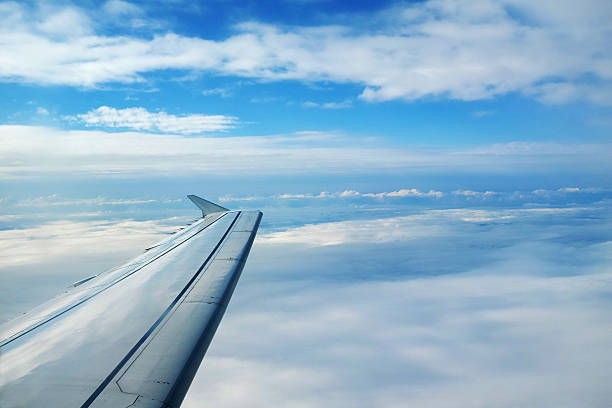 Airplanes Wing With Amazing View Of Clouds Photo Taken stock photo