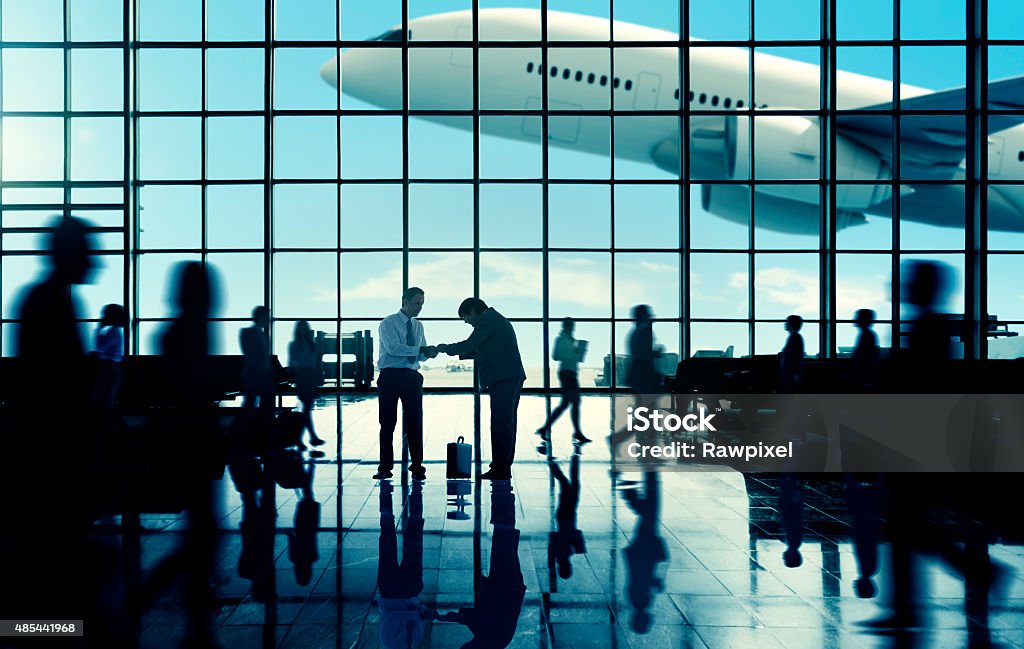 Business Travel Handshake Commuter Terminal Airport Concept **NOTE TO INSPECTOR: These airplane are our own 3D generic designs. They do not infringe on any copyrighted designs.** Busy Stock Photo