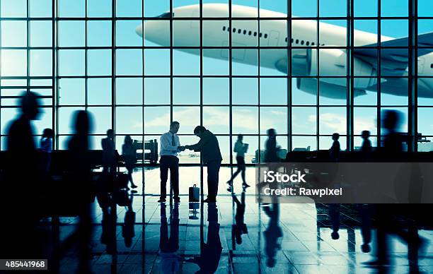 Business Travel Handshake Commuter Terminal Airport Concept Stock Photo - Download Image Now