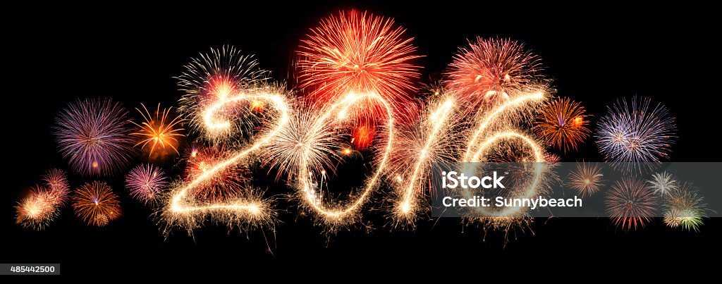 New Year 2016 New year fireworks and 2016 written in sparkling letters Firework - Explosive Material Stock Photo