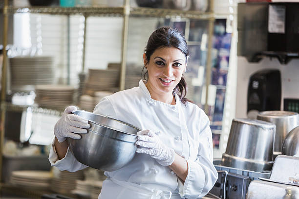 istock Female chef in a commercial kitchen 485445432