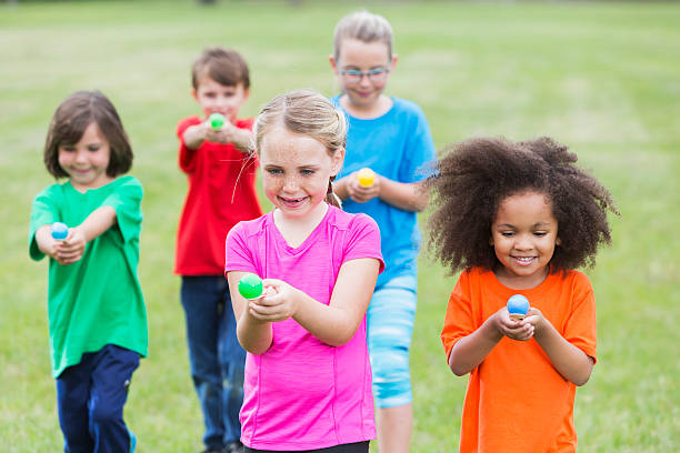 istock Multiracial group of children in an egg spoon race 485445456