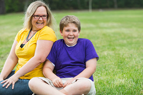 istock Mother and son laughing in the park 485445458