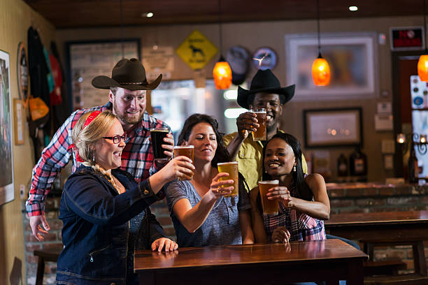 istock Multiracial group of friends drinking beer, toasting 485445474
