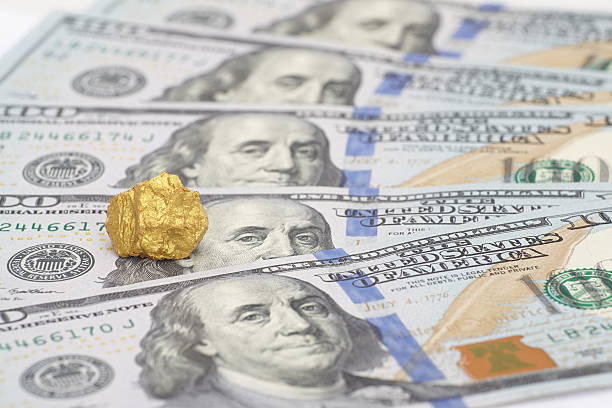 Gold and dollar bills Nugget Gold and dollar bills chuck norris goldco stock pictures, royalty-free photos & images