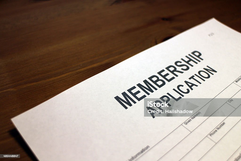 Membership Form Someone filling out Membership Application form Accessibility Stock Photo
