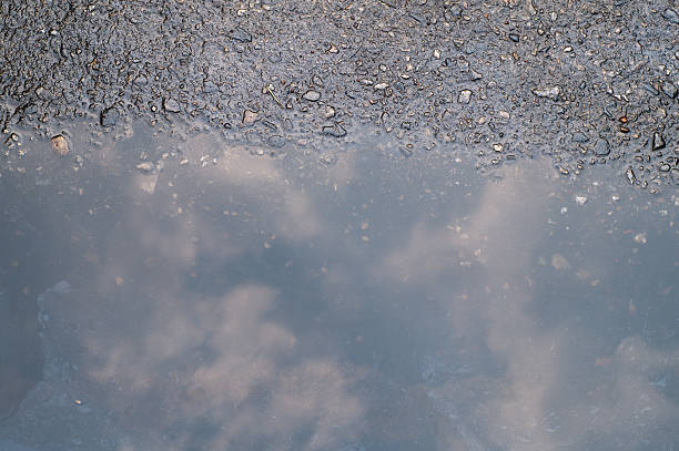 istock reflection of sky on wet street after rain 485449287