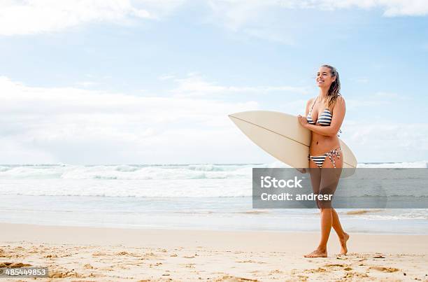 Woman Surfing At The Beach Stock Photo - Download Image Now - Adult, Adults Only, Aquatic Sport