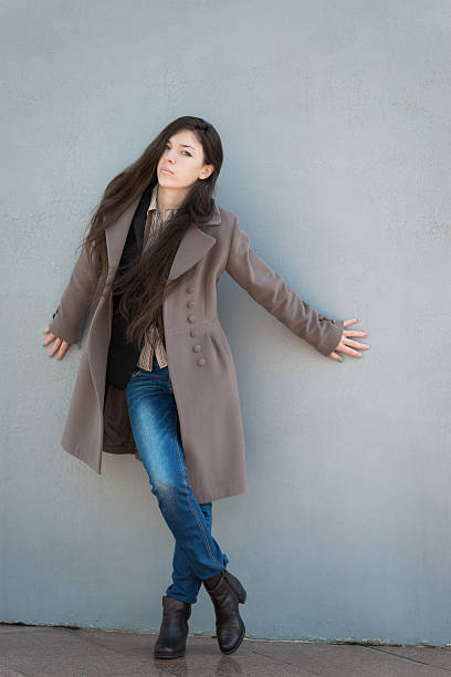 istock Young girl in coat. 485452321