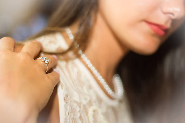 istock girl with ring and pearls 485454378