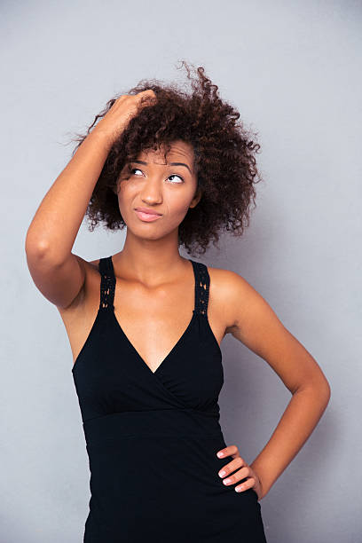 istock Pensive afro american woman looking up 485455246