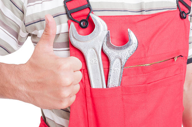 istock Like gesture by mechanic with wrenches inside chest pocket 485456006