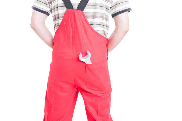 istock Wrench inside back pocket of mechanic or plumber rompers 485456042