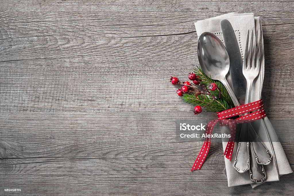 Christmas table place setting Christmas table place setting with christmas pine branches,ribbon and bow. Christmas holidays background  Christmas Stock Photo