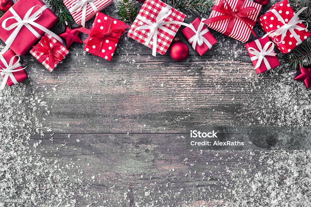 Christmas background Christmas background with decorations and gift boxes on wooden board Christmas Stock Photo