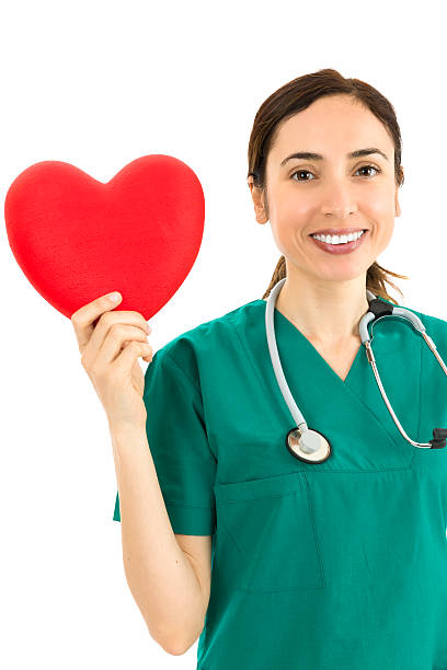 istock Female surgeon showing heart 485458836
