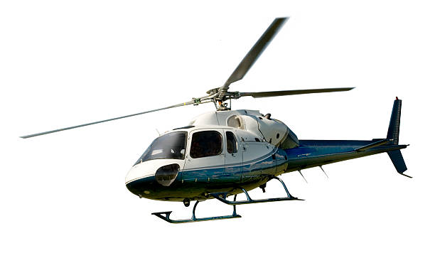 helicopter in flight isolated against white - helikopter stockfoto's en -beelden