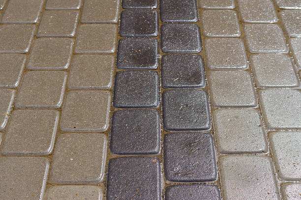 istock Wet decorative dark and light tiles, road detail 485463272