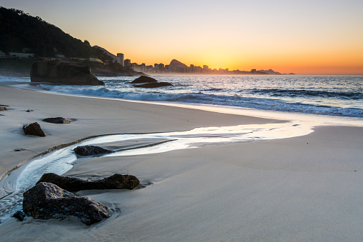 Sunrise in Rio, capturing Ipanema Beach, the town of Leblon and Sugarloaf Mountain.