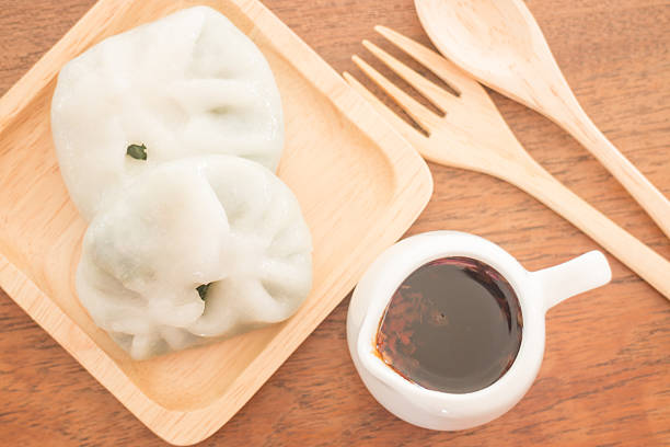 istock Steamed dumpling stuff serving on wooden plate 485464072