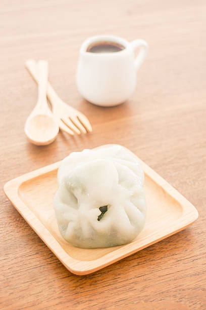 istock Steamed dumpling stuff serving on wooden plate 485464074