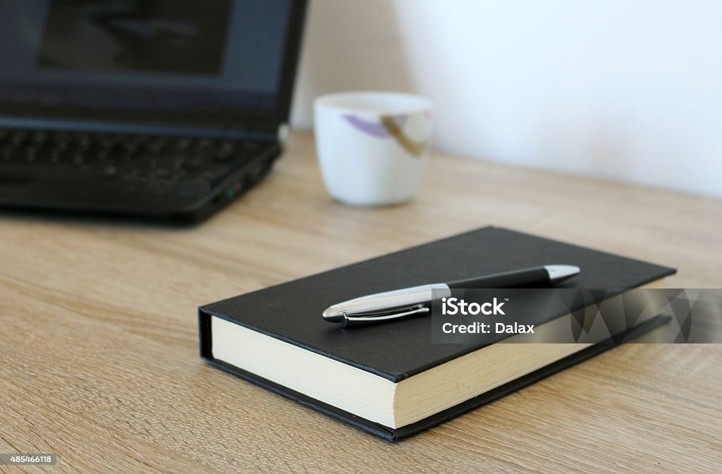 Workspace with notebook, coffee, pen and paper 2015 Stock Photo