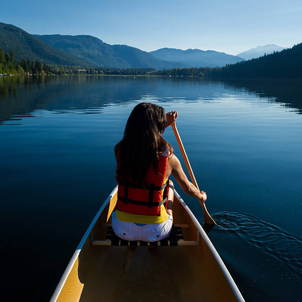 Early morning canoe trip on an alpine lake