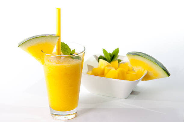 yellow watermelon smoothie with fresh mint stock photo