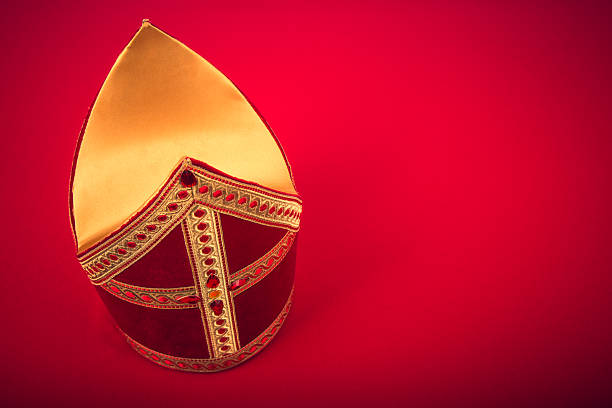 Mijter of sinterklaas Mitre or mijter of Sinterklaas. On red background with copy space and vignette. Part of a dutch sancta tradition mijter stock pictures, royalty-free photos & images