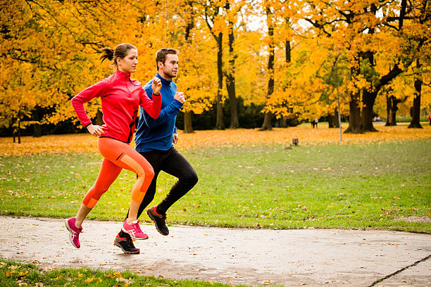 istock Couple jogging in autumn nature 485469414
