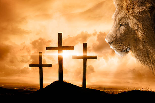 God's Victory at Calvary A brilliant sky illuminates the empty crosses on the day of Jesus' crucifixion. God, The Lion of Judah, overlooks the hill where His son Jesus died and won the victory for sinners. self sacrifice stock pictures, royalty-free photos & images