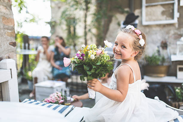 Little girl dressed as a bride Adorable girl on wedding party flower girl stock pictures, royalty-free photos & images