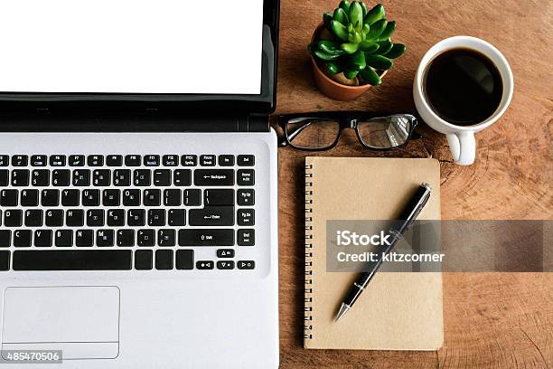 Laptop And Cup Of Coffee On Old Wooden Table Stock Photo - Download Image Now - 2015, Business, Business Finance and Industry